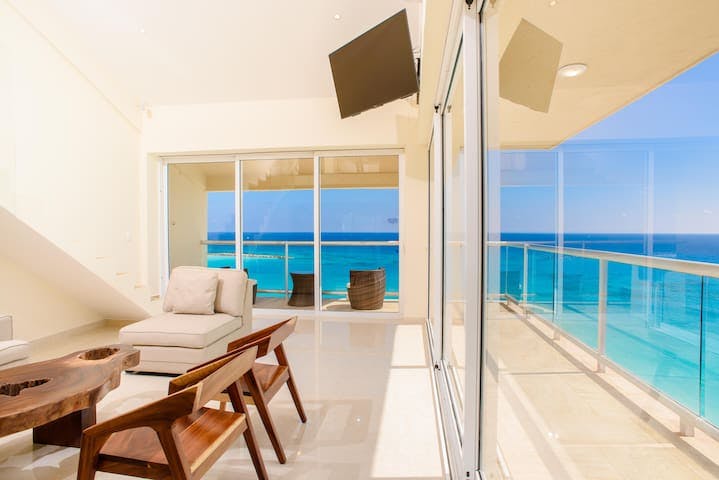 Panoramic views for every room in this two story, oceanfront Penthouse! Wrap around balcony in the living room with doors that open the entire length of the wall!