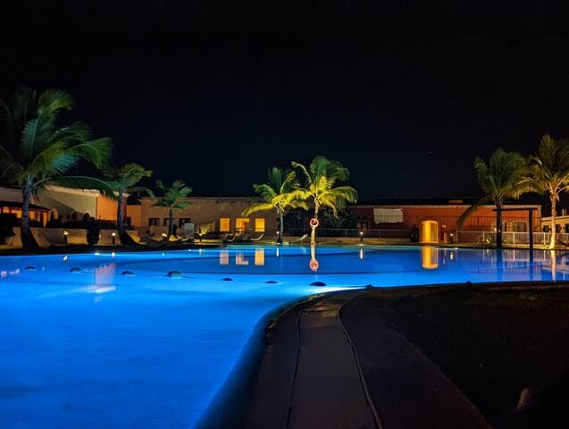 Serene pool seen at night showing its beautiful glow.

Closest pool (2 min walk) to your accommodations.