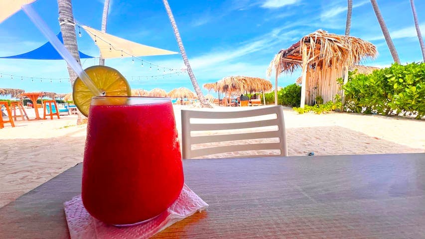 Enjoy your favorite frozen cocktail (or mocktail)  beach side at the local Villa Blanca Beach Club just a short walk from our front door.

10 min walk.