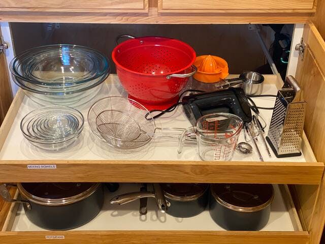 Mixing bowls, baking sheets, mixing blender, cheese grater, measuring cups, strainers, pots and pans.  