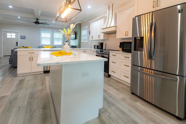 A large chef sized kitchen is perfect for your visit. All top end appliances. A large center island for meal prep or gathering. Views to the whole home. We have provided all of the dishes, utensils, glassware and many other kitchen items.