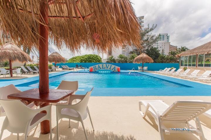 Pool features sun loungers, Palapas and a small bar and restaurant.