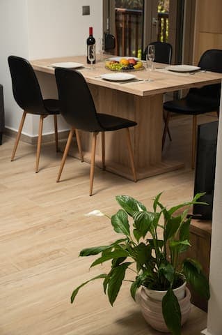 A modest space that beckons you to share meals and stories, surrounded by the warmth of Mediterranean hospitality.