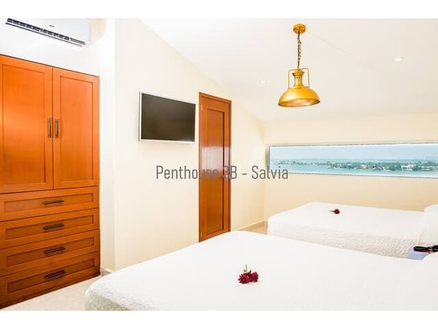 Upstairs bedroom has an on suite bathroom with plenty of storage space and a safe