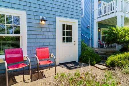 This queen bedroom/full bathroom suite has its own entrance (pictured). It is at the ground level of the ADU building just next to the house, and is accessed by an exterior stairway that is between the buildings.