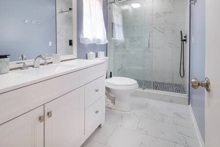 Master bathroom with waterfall shower.