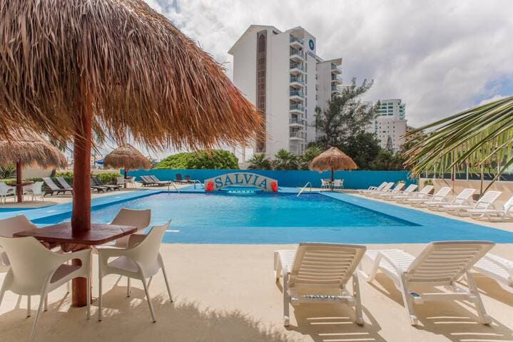 Nice pool (including kids pool in the back) with a restaurant and bar pool side.