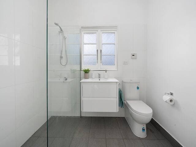 Bathroom with walk-in shower. Natural Gas with "Continuous Flow" Hot Water.