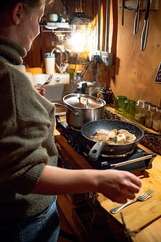 Cooking in Keppoch Bothy on the electric hob, which can be stored away to give more counter space :)