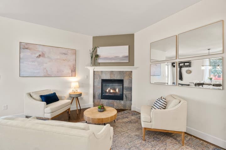 While your food is cooking, take a break and have a chat by the fire in this open concept living room.