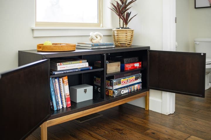 3. Game nights will be a blast with lots of choices to entertain the whole family. The console is also filled with cookbooks.