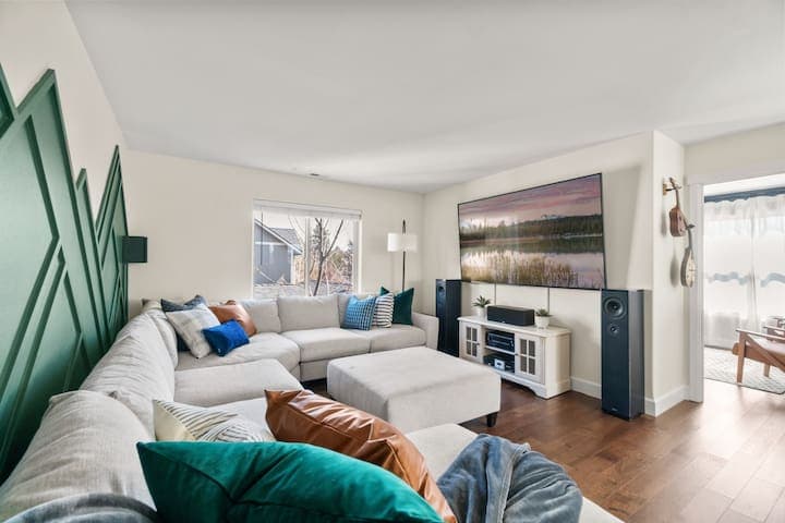 Massive couch for the whole family to enjoy the 86-inch TV in the Movie Theater with surround sound.