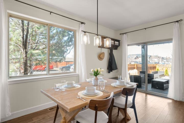 The dining table seats four, with room for two more at the kitchen counter.