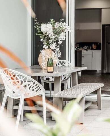 We love this outdoor setting, perfect for dining under the festoon lights in the backyard.