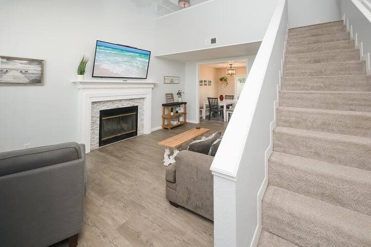 The minute you walk in, the high ceilings, natural light, spacious living room and loft area give vacation energy.