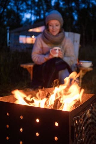 There are four Adirondack chairs for sitting out at Keppoch Bothy at the corten steel Firepit/BBQ