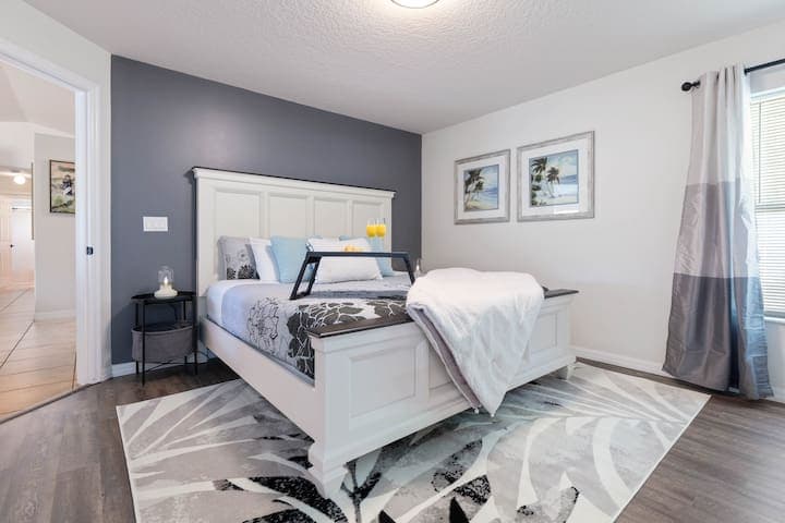 Primary (Master) Bedroom with king size bed, full walk in closet and attached full bathroom with walk in shower.