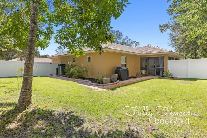 View of the fully fenced side yard for the dogs.