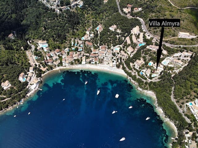 Villa Almyra is perched at the top of a lushious green olive tree coverded hill. Bellow, the private path and access to the beachcove can be distinguished between the shrubs of our private beach front land.