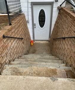 Private Entrance | Keyless Access Stairs with rails lead down to the front door, providing safe and easy access. Secure keyless entry with code. Outdoor night light controlled by an indoor switch for your convenience.