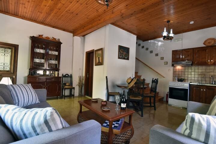 Open plan living space with 2 comfy sofas, Flat Screen TV, fully equipped kitchen and dining table