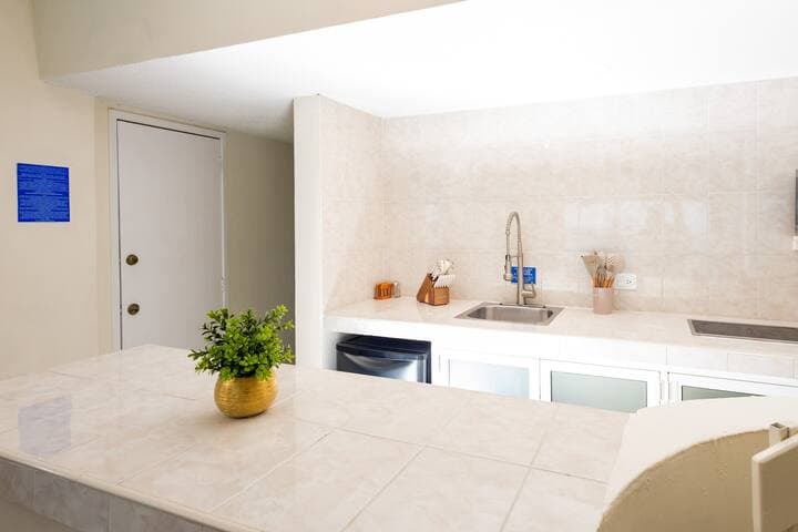 Kitchen has a mini fridge that is large enough for beer, soda, water and a light run to the grocery store. Also includes microwave, stove top (2 burners), blender, toaster, coffee maker.