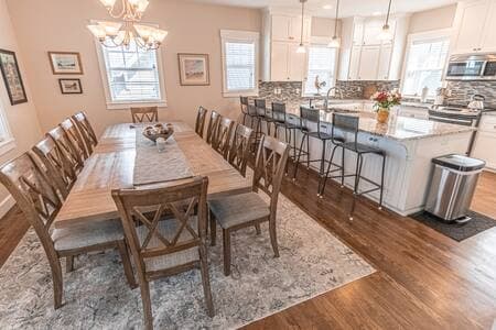 Dining table comfortably seats 12, and the bar adds 5, for large groups.