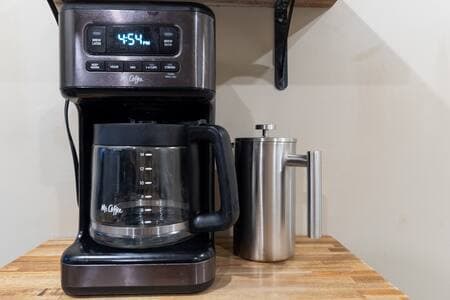 Kitchen | Coffee Station Coffee station includes a traditional Mr. Coffee drip maker, French press, and an unpictured Keurig. Coffee, tea, sugar and powdered cream in cupboards.